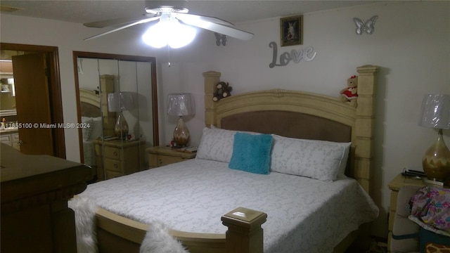 bedroom with ceiling fan and a closet