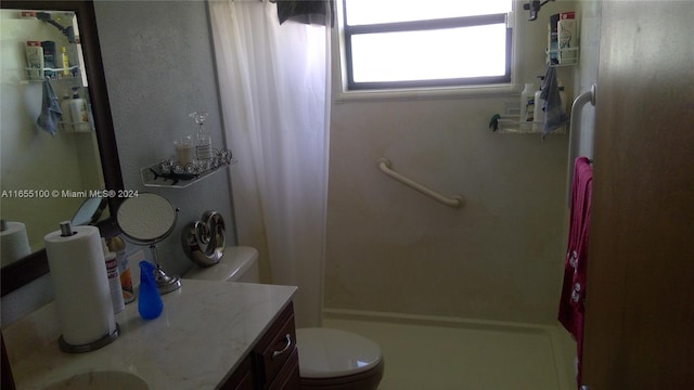 bathroom with vanity, toilet, and a shower with shower curtain