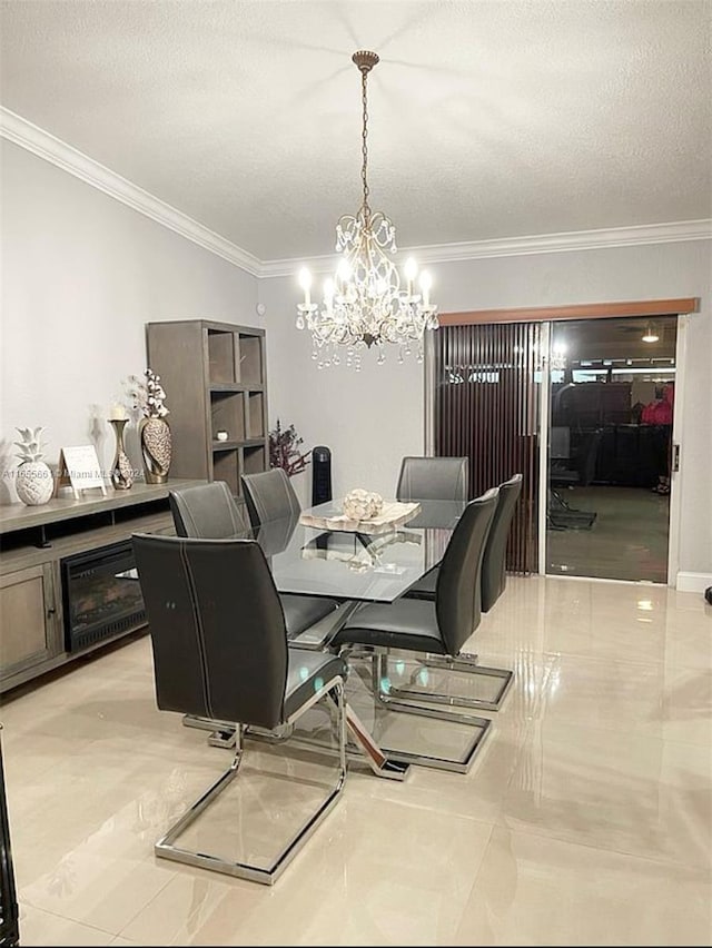 tiled dining space featuring a textured ceiling, crown molding, and a notable chandelier