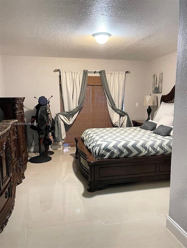 bedroom with a textured ceiling