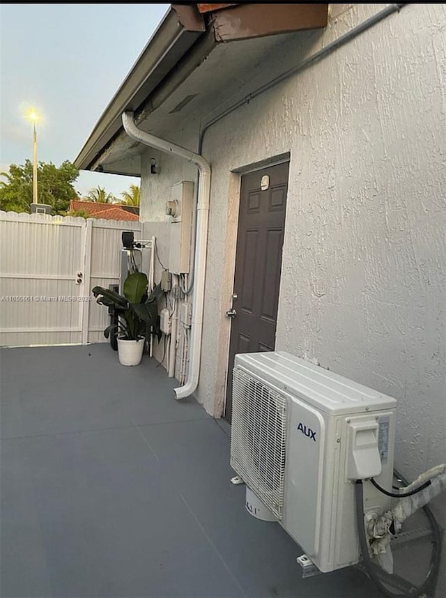 entrance to property with ac unit and a patio area