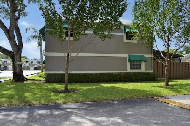 view of home's exterior featuring a yard