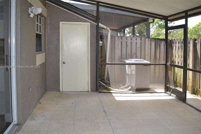 unfurnished sunroom with plenty of natural light