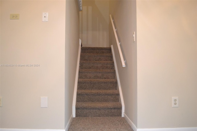 staircase with carpet