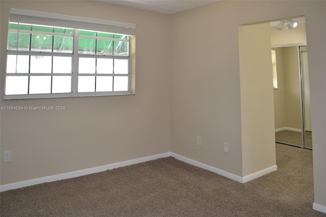 spare room featuring carpet flooring