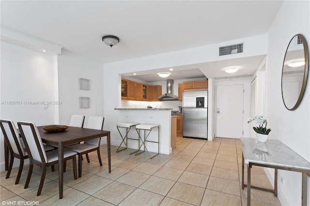 dining area with light tile patterned floors