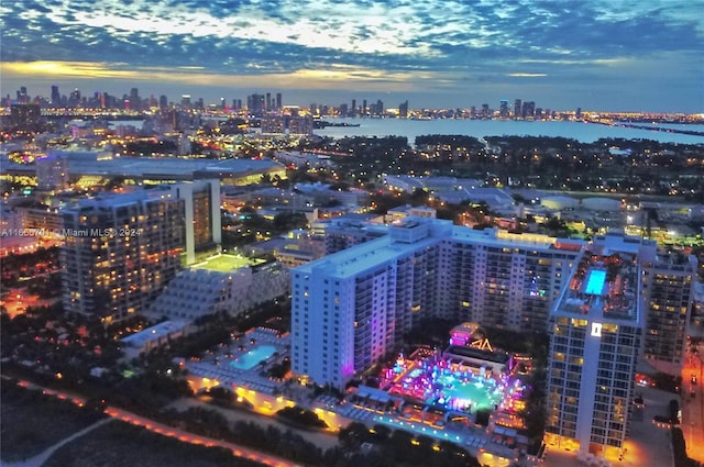 aerial view at dusk with a water view