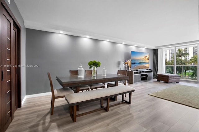 dining room with light hardwood / wood-style flooring