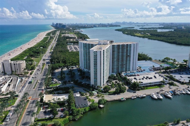 bird's eye view featuring a water view and a view of the beach