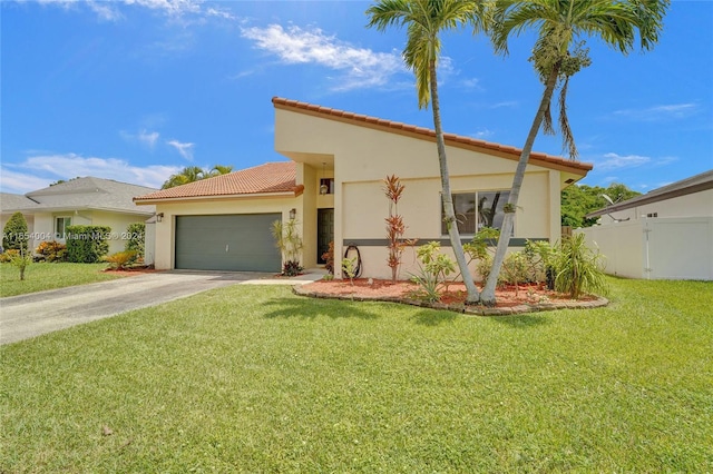 mediterranean / spanish-style home featuring a front yard and a garage