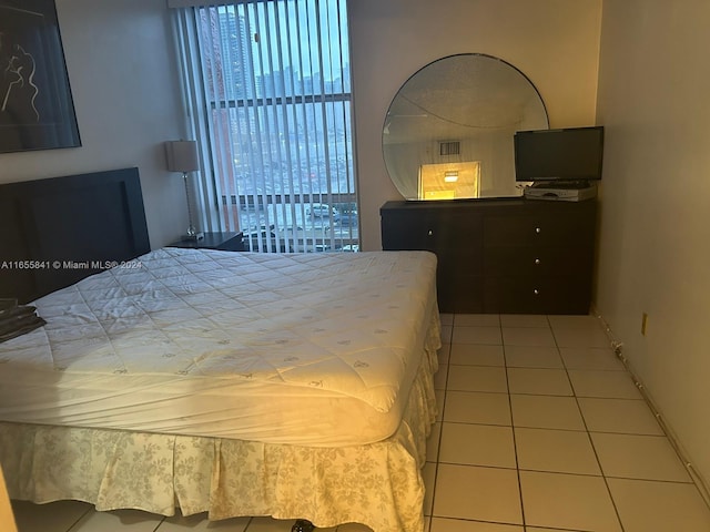 bedroom featuring light tile patterned floors