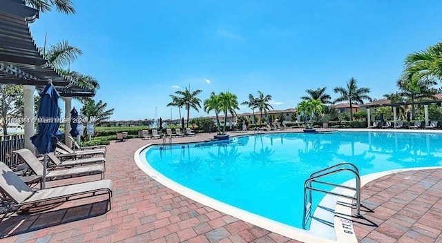 community pool with a patio area