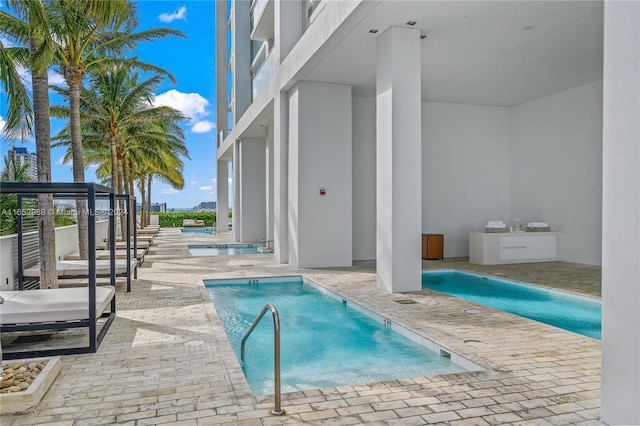 view of pool featuring a patio area