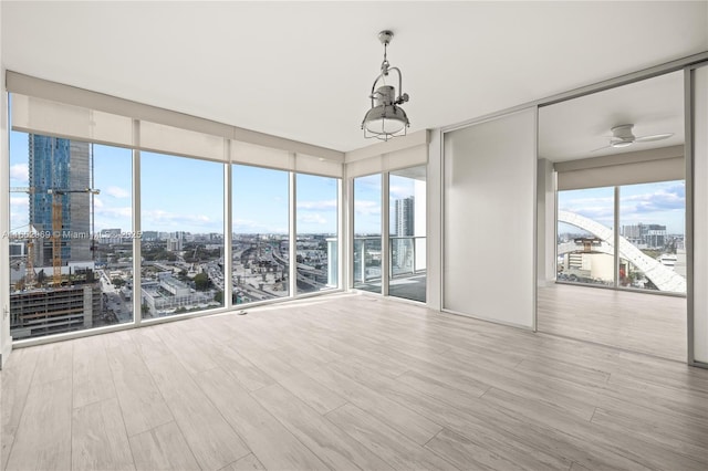 interior space with ceiling fan