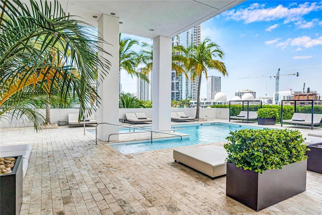 view of pool featuring outdoor lounge area and a patio area