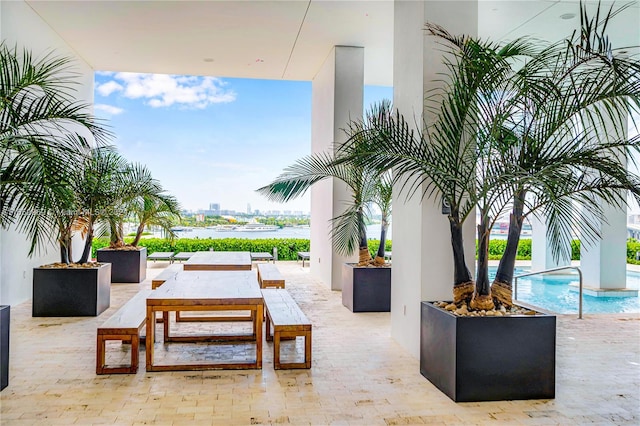 view of patio / terrace with a water view