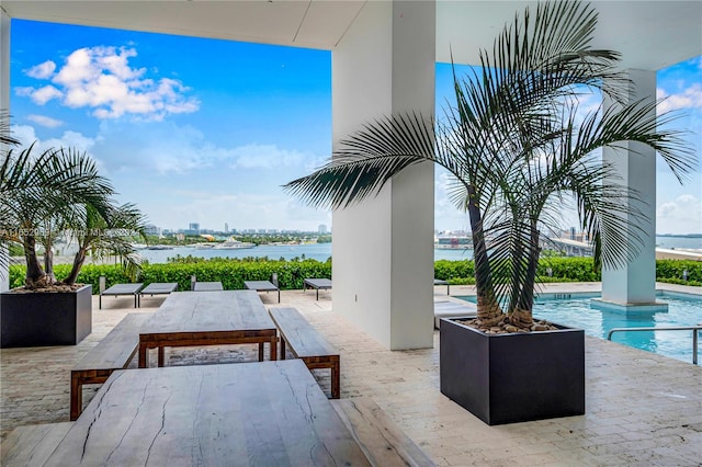 view of patio featuring a water view