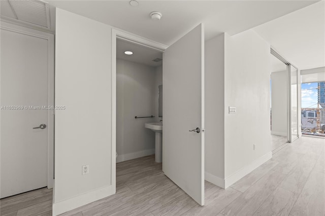 hallway featuring light hardwood / wood-style floors