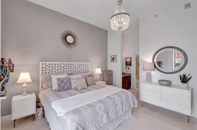 bedroom featuring light colored carpet, ensuite bathroom, and a notable chandelier