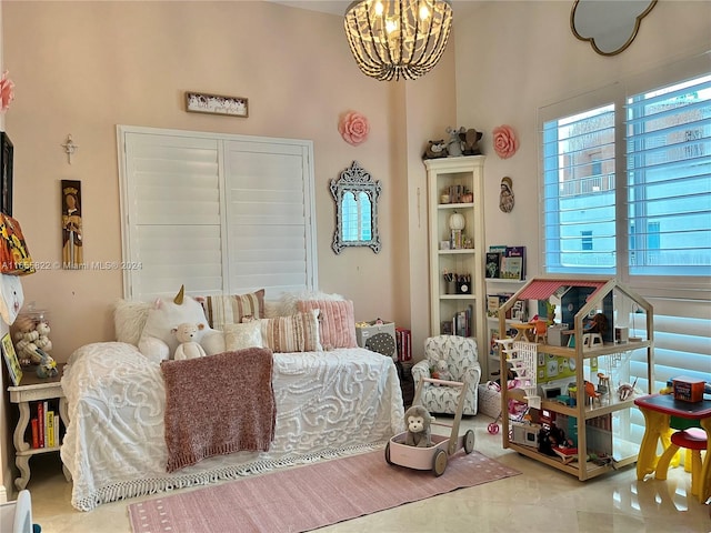 tiled bedroom with an inviting chandelier and a towering ceiling