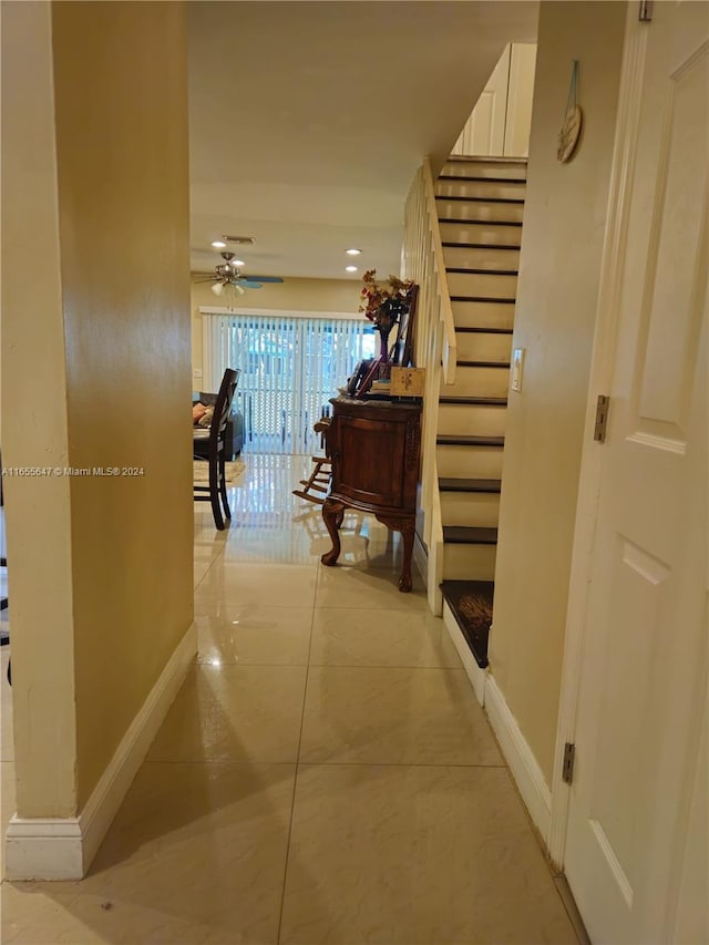 hall with light tile patterned flooring