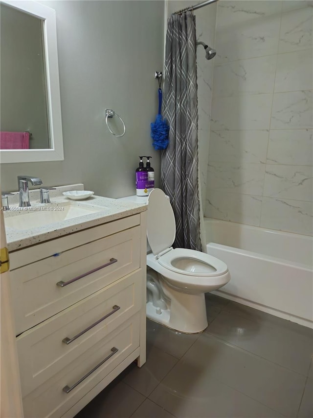 full bathroom featuring tile patterned floors, toilet, shower / tub combo, and vanity