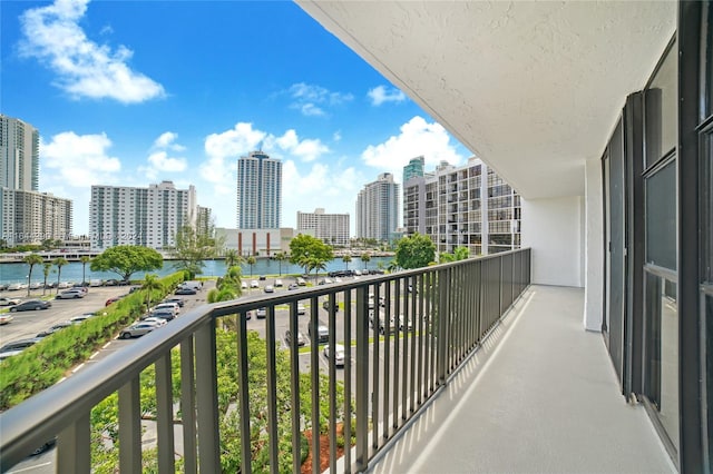 balcony featuring a water view