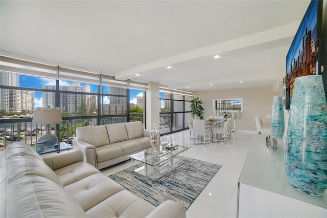 tiled living room featuring a wall of windows