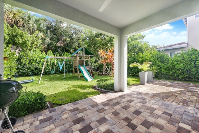 view of patio featuring grilling area and a playground