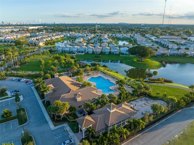 birds eye view of property with a residential view and a water view