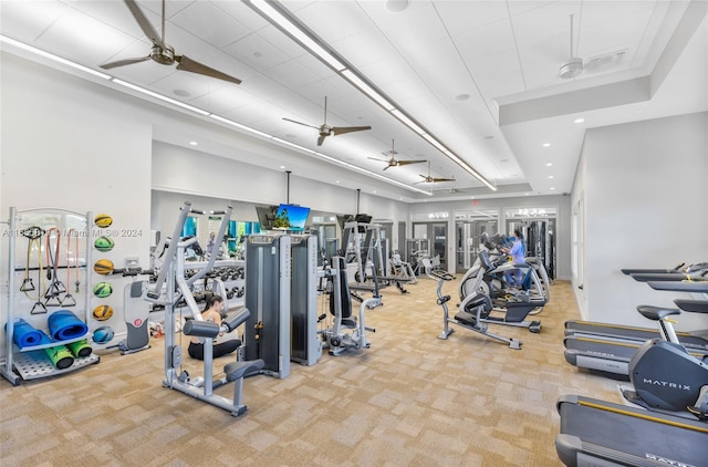 gym with carpet flooring and ceiling fan