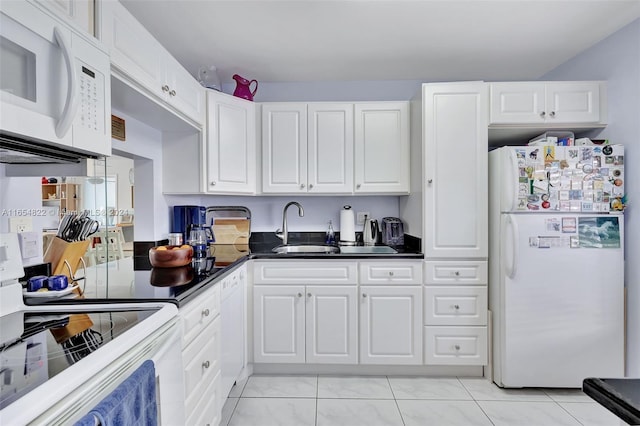 kitchen with white cabinets, white appliances, and sink