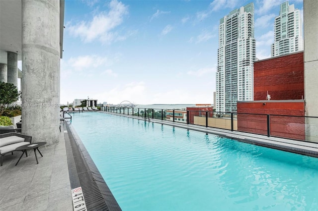 view of swimming pool featuring a view of city