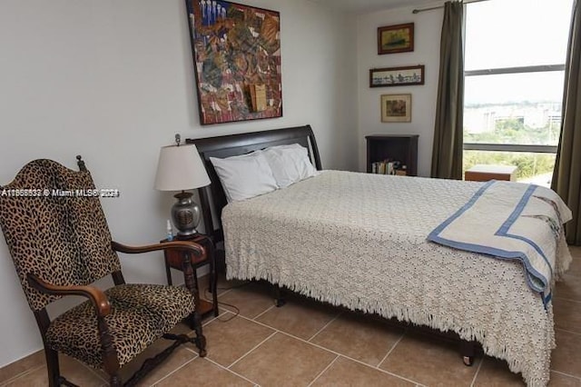 bedroom with tile patterned floors