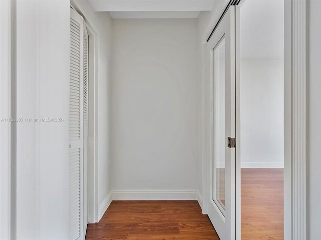 hallway with dark hardwood / wood-style floors