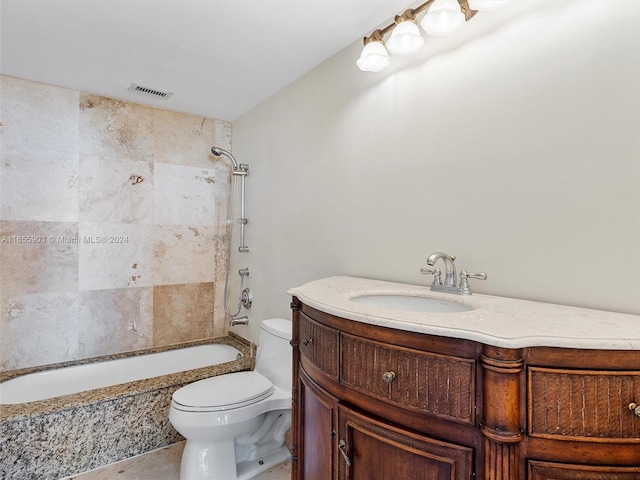 full bathroom featuring toilet, tiled shower / bath combo, and vanity