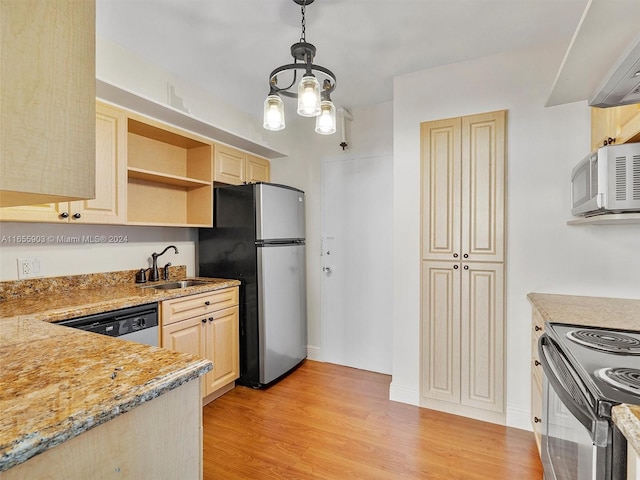 kitchen with pendant lighting, a chandelier, light hardwood / wood-style flooring, sink, and appliances with stainless steel finishes