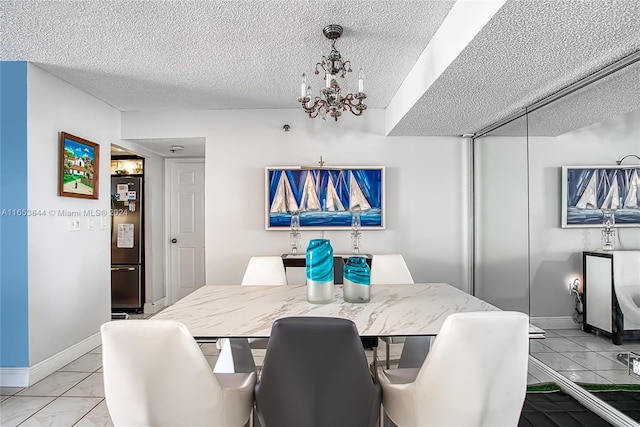 dining space featuring a textured ceiling