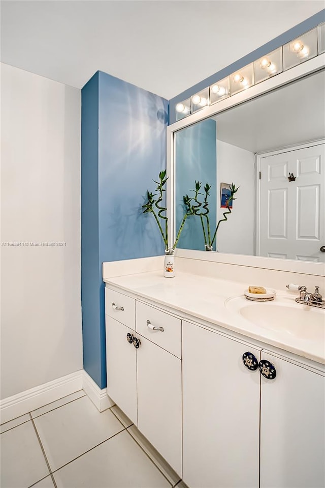 bathroom with tile patterned floors and vanity