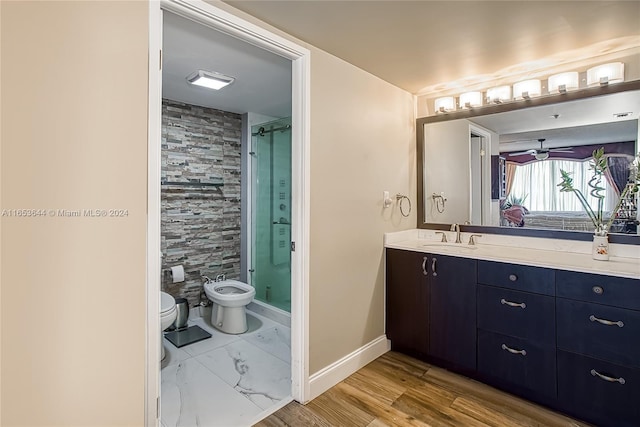 bathroom with a bidet, wood-type flooring, a shower with shower door, and vanity