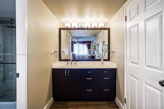 bathroom featuring an enclosed shower, hardwood / wood-style flooring, and vanity