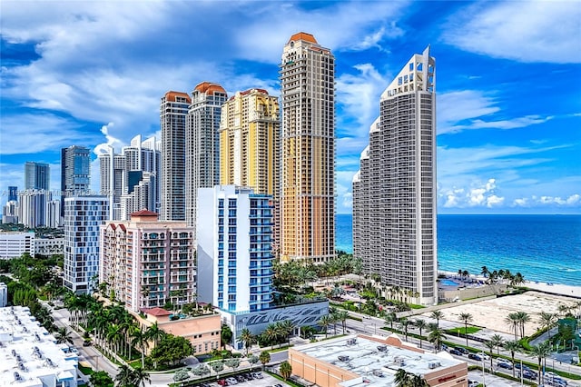 property's view of city featuring a beach view and a water view