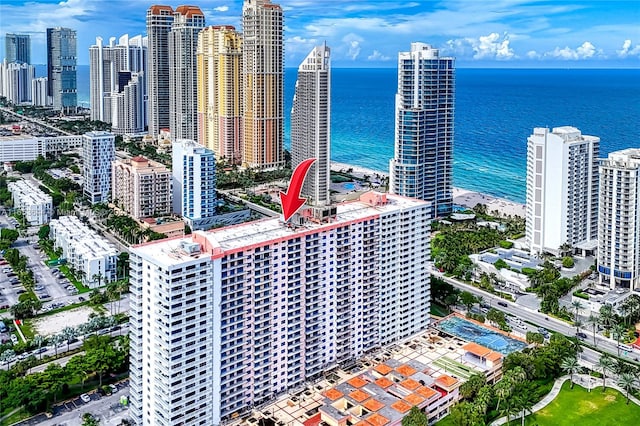 bird's eye view with a beach view and a water view