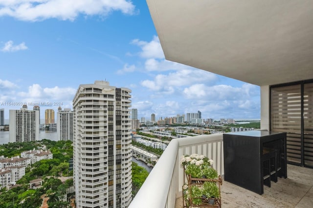 balcony featuring a water view