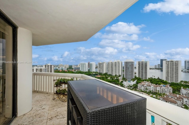 balcony featuring a water view