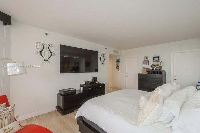 bedroom featuring light wood-type flooring