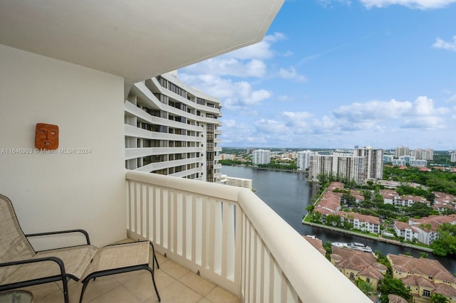 balcony featuring a water view