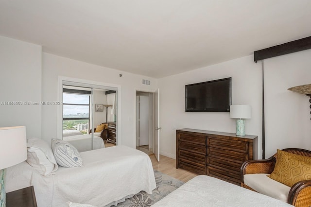 bedroom featuring a closet and light hardwood / wood-style floors