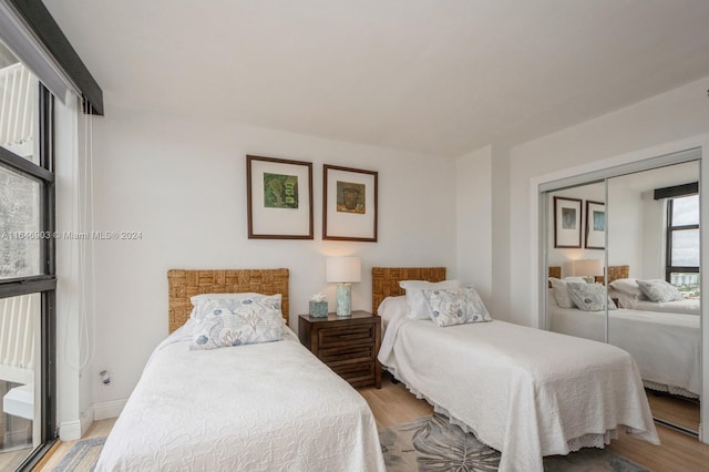 bedroom featuring light hardwood / wood-style flooring and a closet