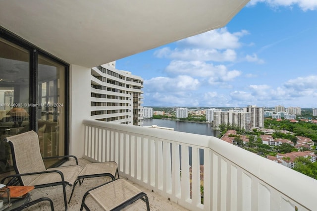 balcony featuring a water view